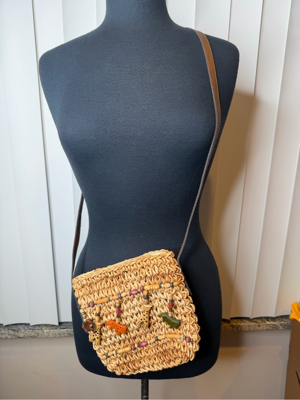 Cappelli Straworld crossbody bag dangling wooden safari animal cut-outs + beads